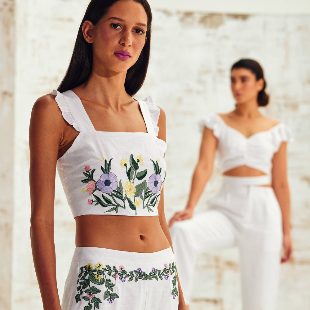 Models Flaunting White Linen Sleeveless Tops in a Stylish Showcase.