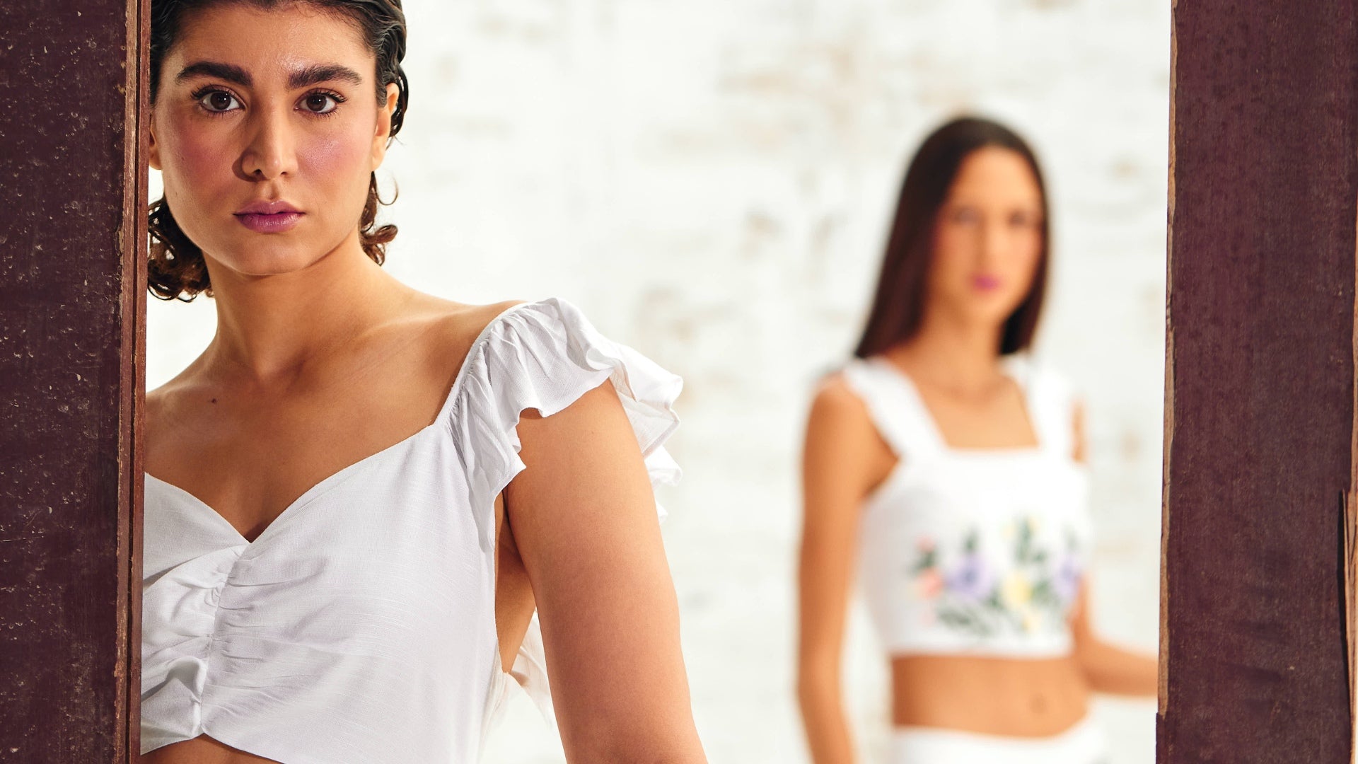 Models Flaunting White Linen Sleeveless Tops in a Stylish Showcase.