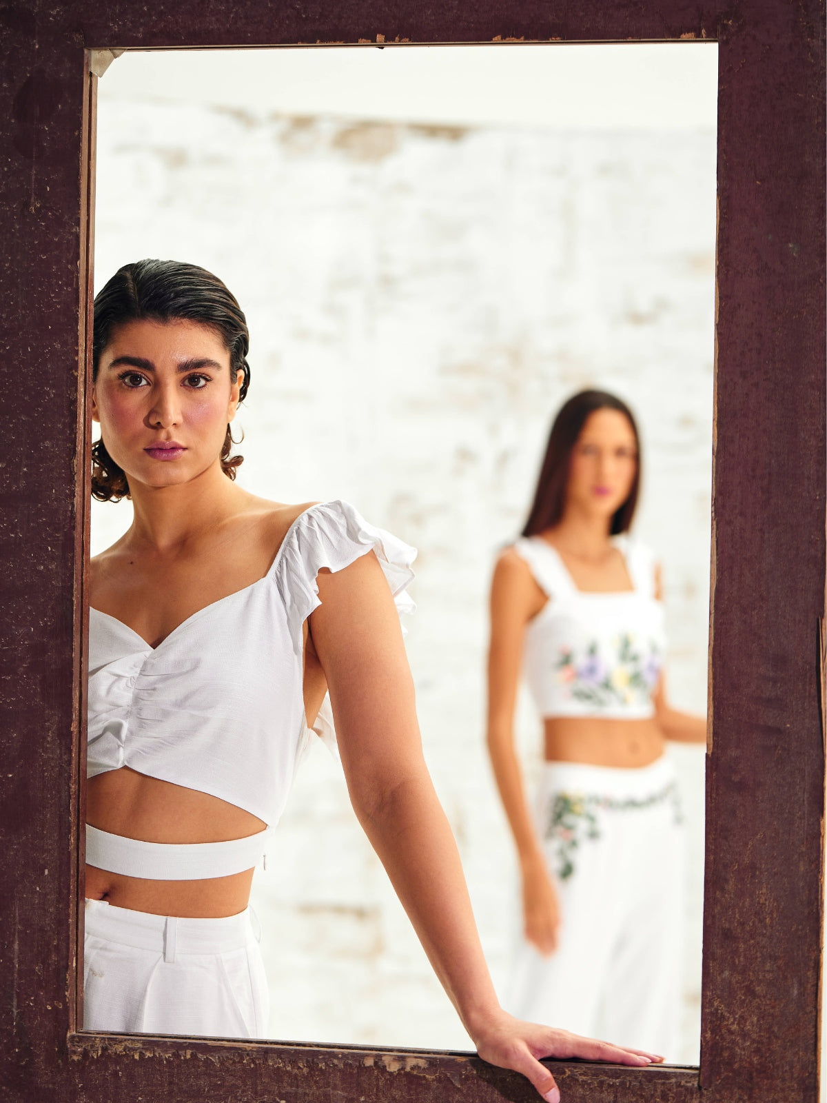 Models Flaunting White Linen Sleeveless Tops in a Stylish Showcase.