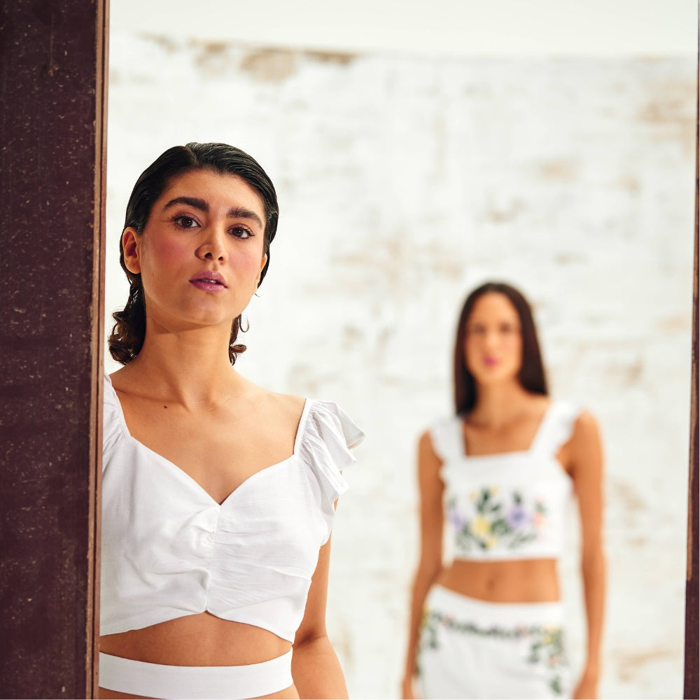 Models Flaunting White Linen Sleeveless Tops in a Stylish Showcase.